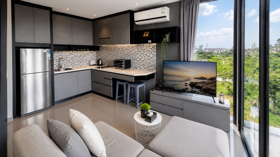 Deluxe Apartment, 1 Bedroom (Chic n Cozy CityGate 1BR Suite) | Living room | Flat-screen TV