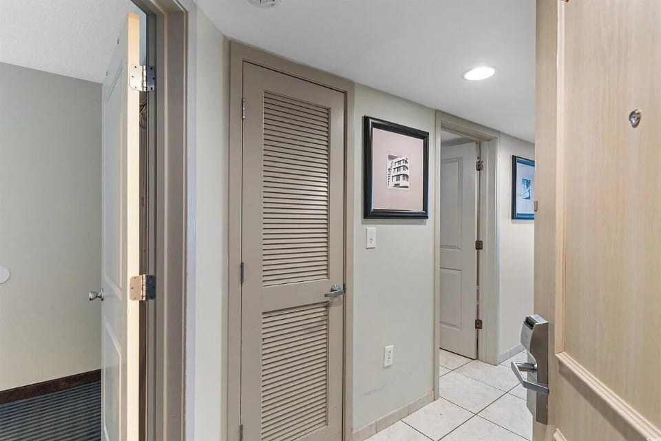 Spacious welcoming unit hallway designed with both style and comfort in mind. 