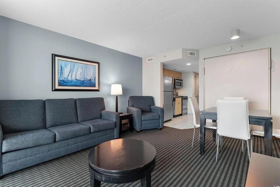 Spacious condo with ocean views, modern furnishings, and an open-plan layout per