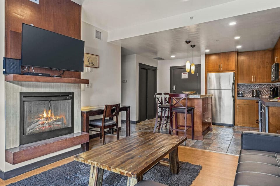 Cozy living area with fireplace and TV