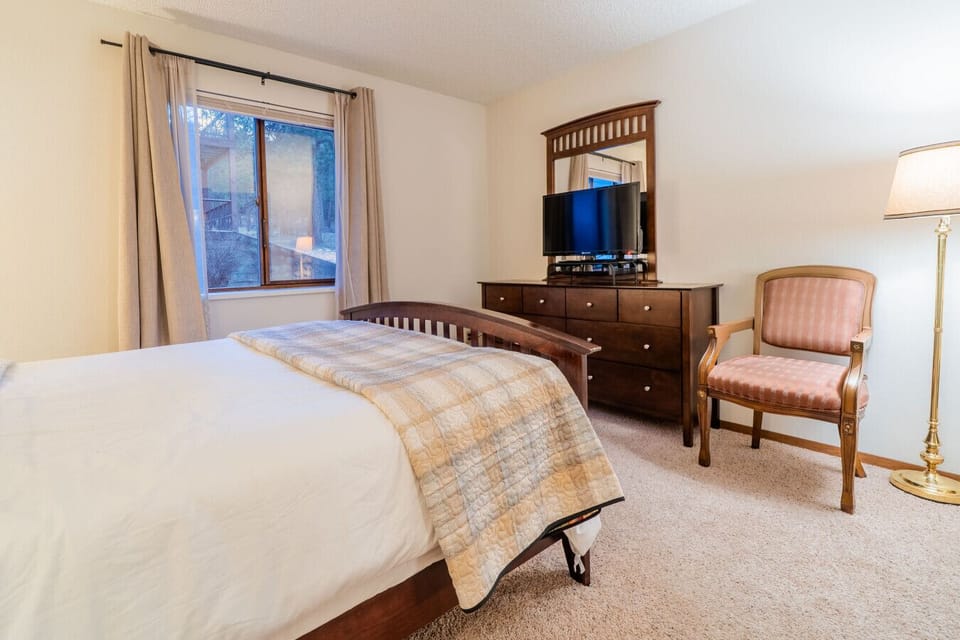 There is a TV in the bedroom