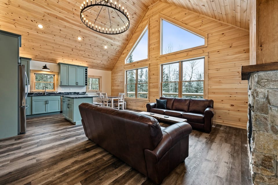 Main floor with vaulted ceilings and large windows