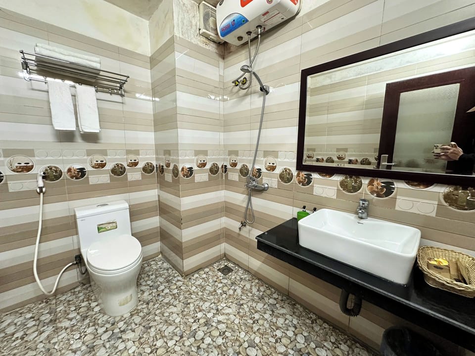 Shower, free toiletries, hair dryer, slippers
