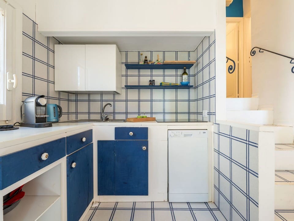 Flooring, Interior Design, Floor, Tile, Kitchen, Countertop, Room, Cabinetry, Plumbing Fixture, Tap