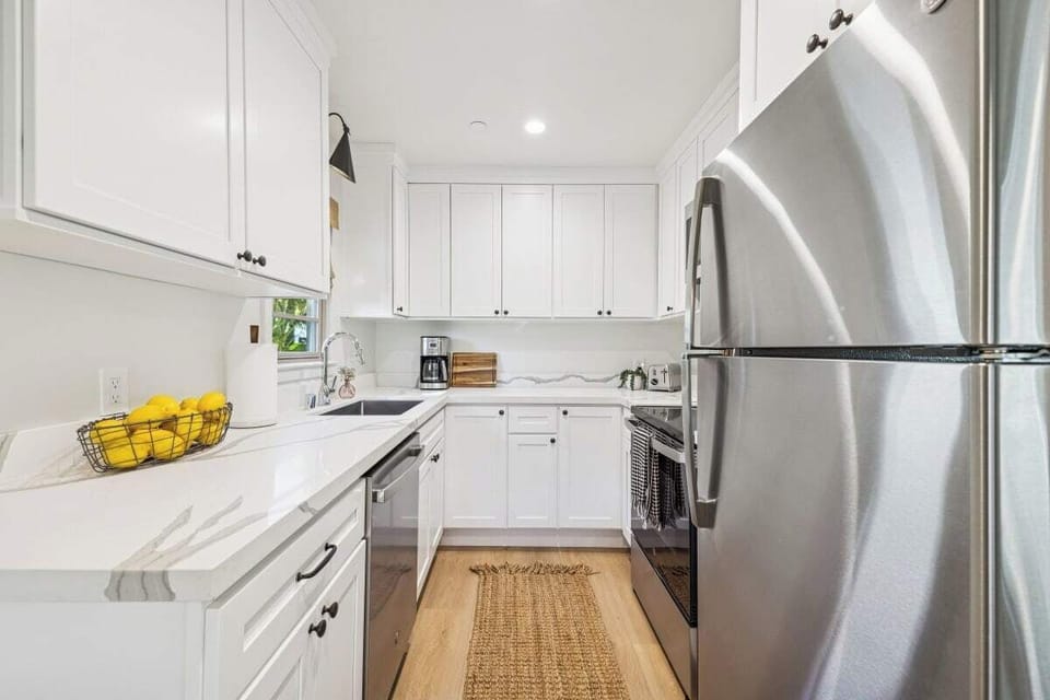 Full kitchen: Coffee drip, fridge, stove/oven, plates and utensils, dishwasher