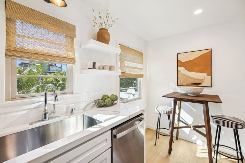 Modern dining nook and kitchen spaces.