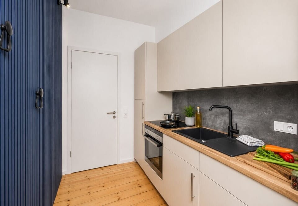 Enjoy the convenience of a stylish, fully equipped kitchen with modern appliances, cooking essentials, and plenty of workspace for preparing meals, snacks, and drinks.