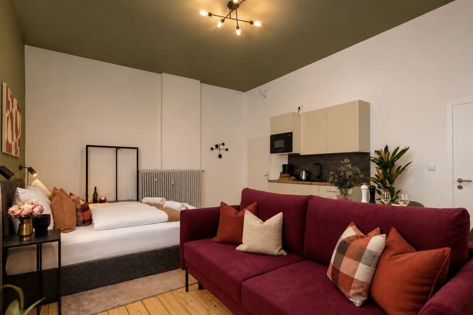 Enjoy a thoughtfully designed studio with comfortable beds, inviting seating, and a convenient kitchenette, offering the perfect balance of comfort and functionality for your stay.