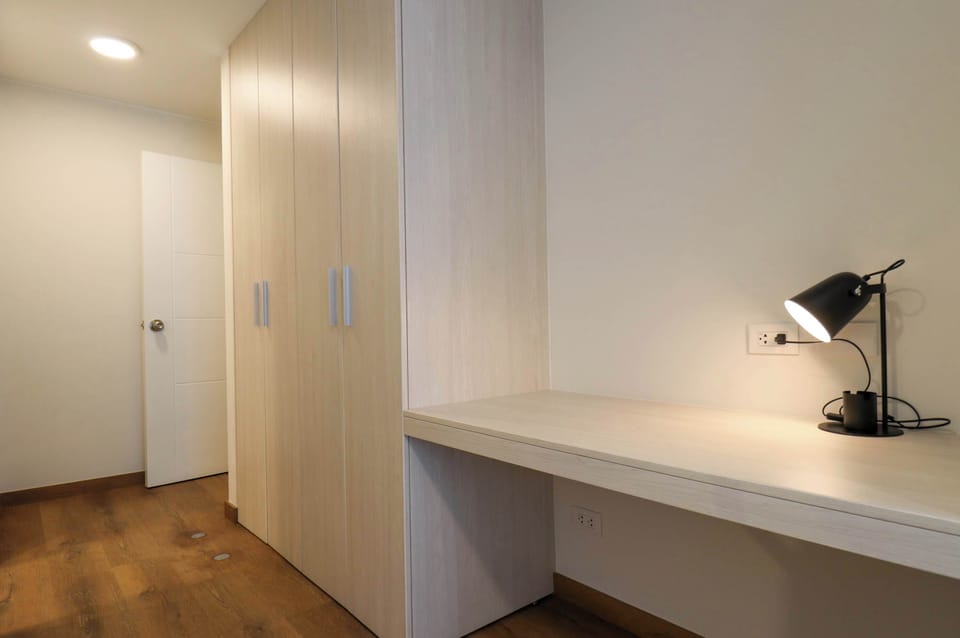 Dedicated workspace with a comfortable desk, perfect for working or studying.