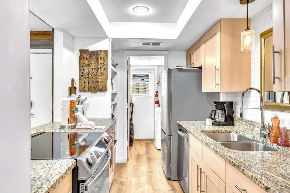 Your fully equipped kitchen features granite countertops, stainless steel appliances, and everything you need to create memorable meals.