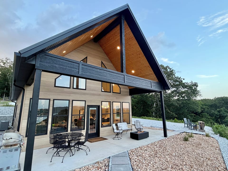 Modern lake house with soaring architecture and spacious outdoor living