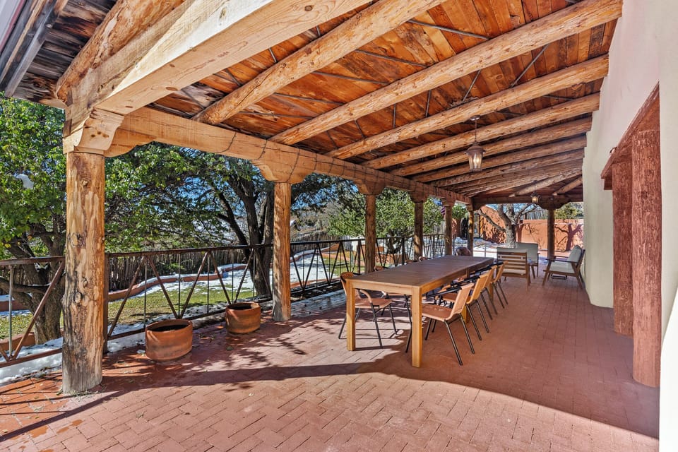 Expansive covered portals with ample seating options overlooking the grounds.