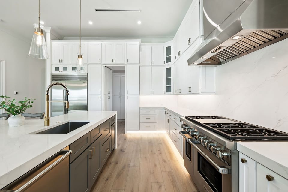 Your chef's dream kitchen awaits with sleek quartz counters, professional-grade stove, and abundant storage for memorable meal preparation.