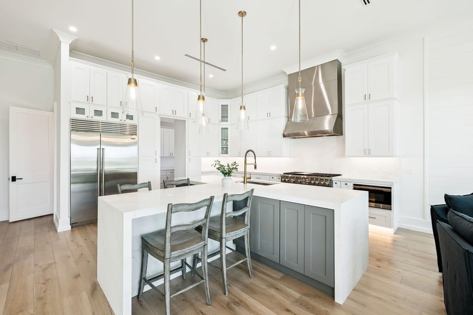 Your gourmet kitchen awaits with premium appliances, marble countertops, and elegant pendant lighting for memorable cooking experiences.