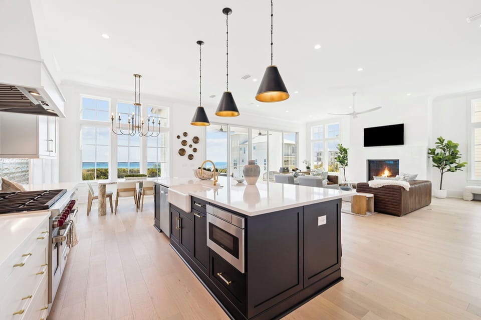 Your gourmet kitchen opens to stunning ocean views, perfect for preparing meals while enjoying breathtaking seaside vistas.