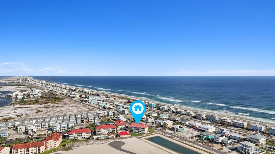 Top floor condo is a short 5 minute walk to the emerald waters of the Gulf