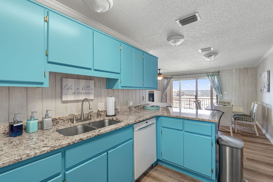 Sweeping views of Santa Rosa Sound from updated kitchen, stocked with essentials