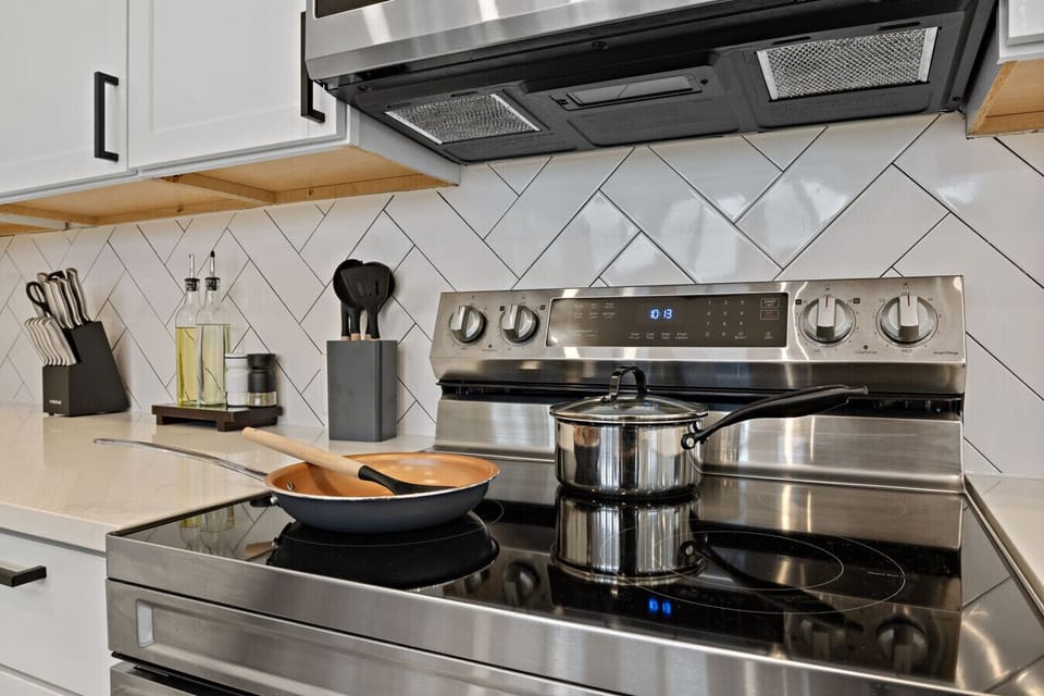 A fully stocked kitchen with quality cookware, sharp knives, and everything you need to cook a proper meal - no grocery run for basics required