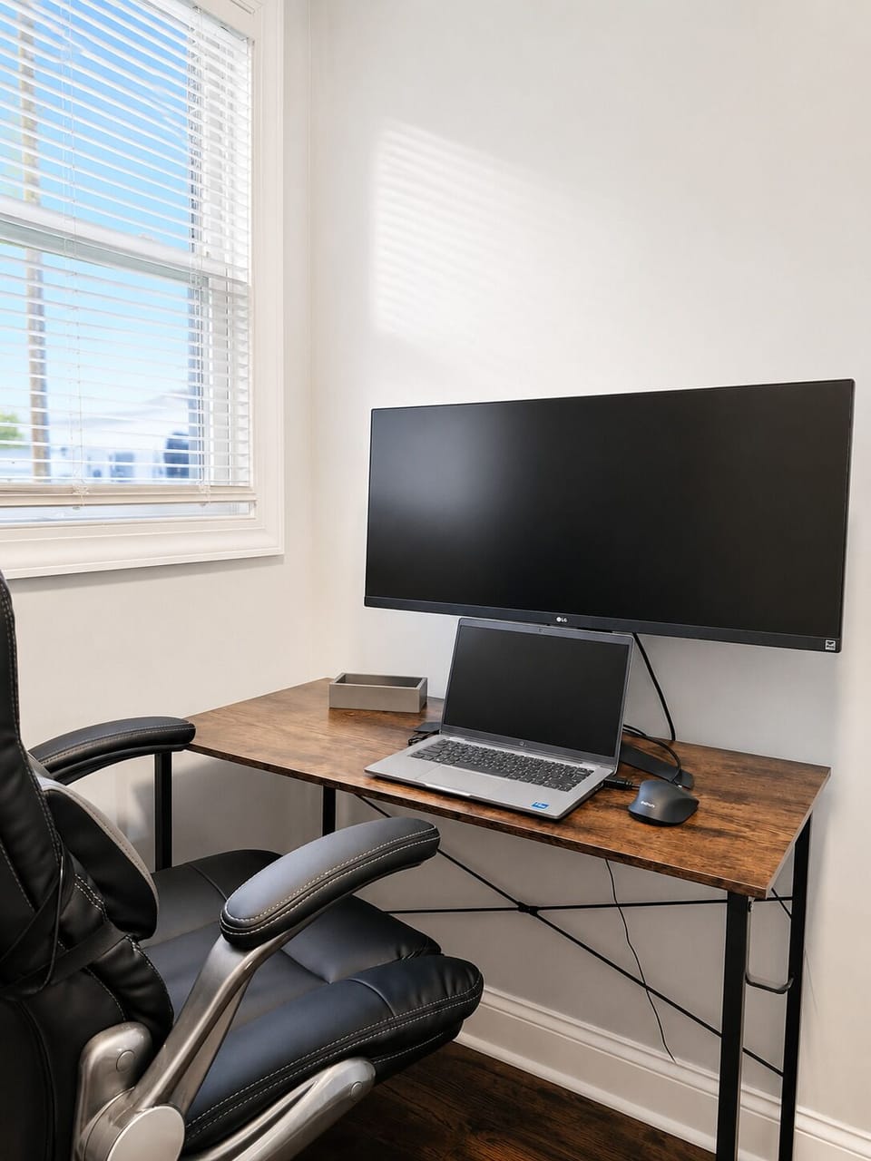work station with monitor in guest bedroom