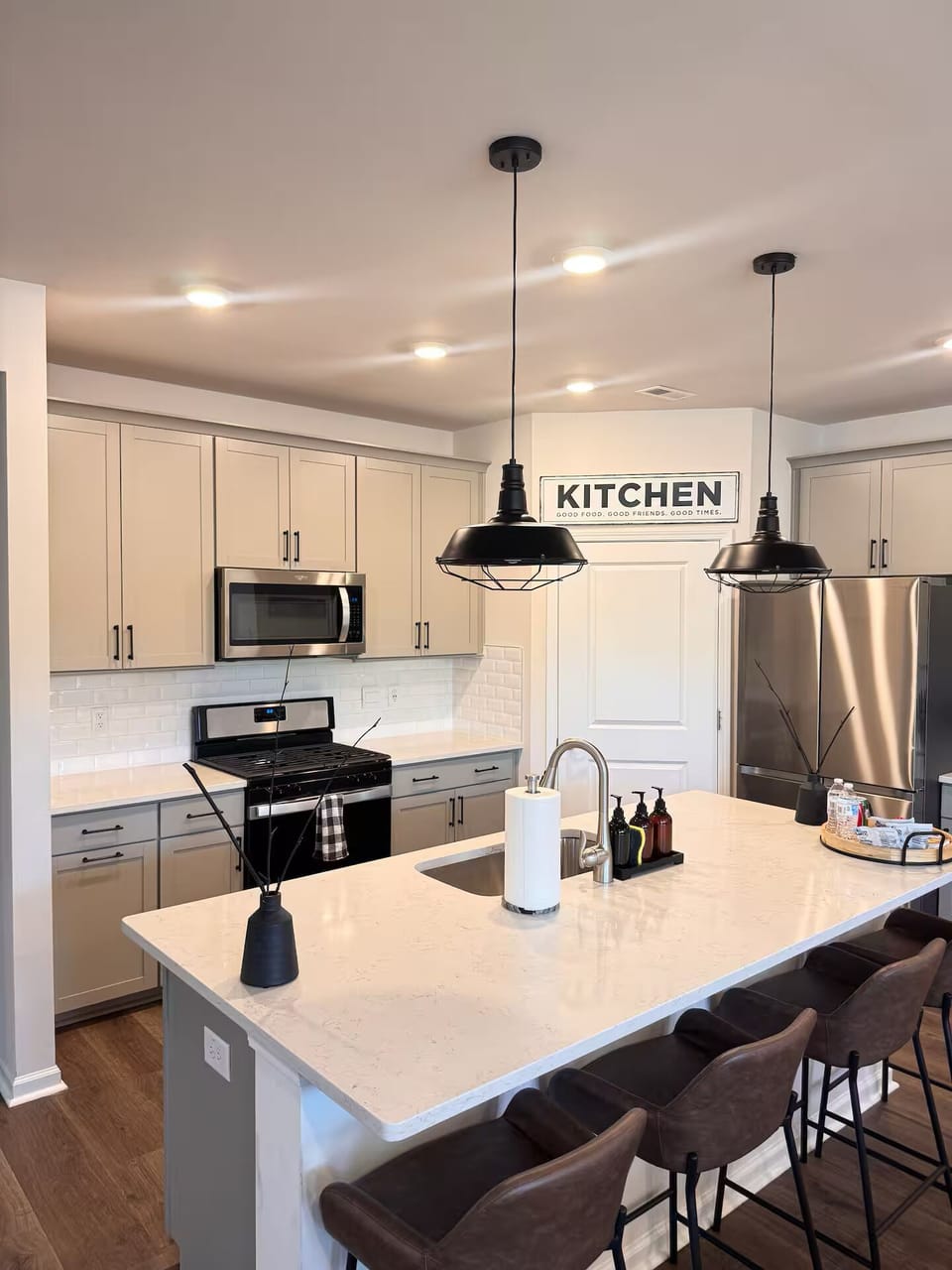 Full Kitchen: open concept, large island, fully equipped with kitchenware.