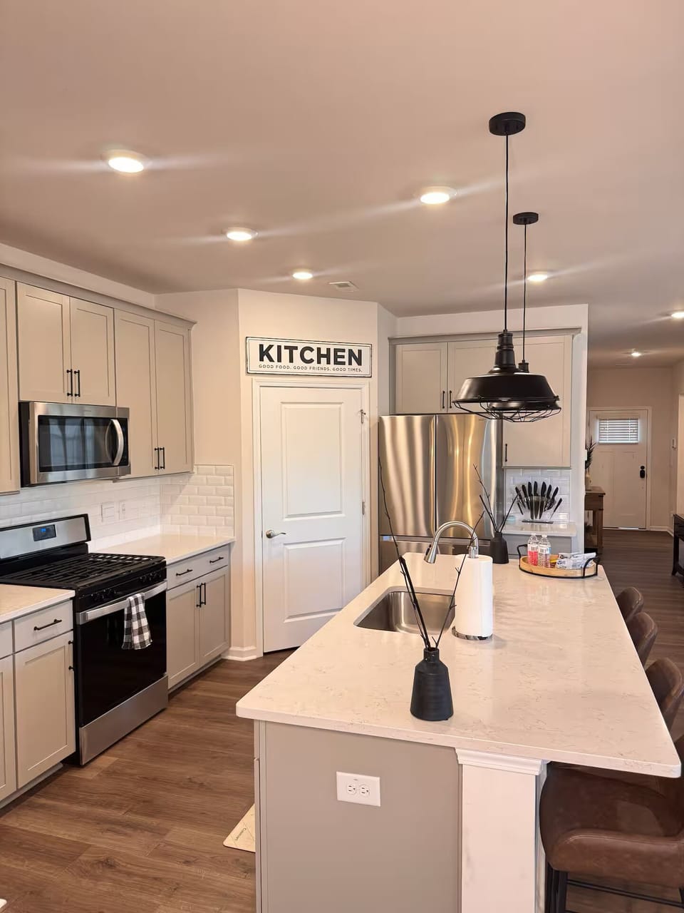Full Kitchen: open concept, large island, fully equipped with kitchenware.