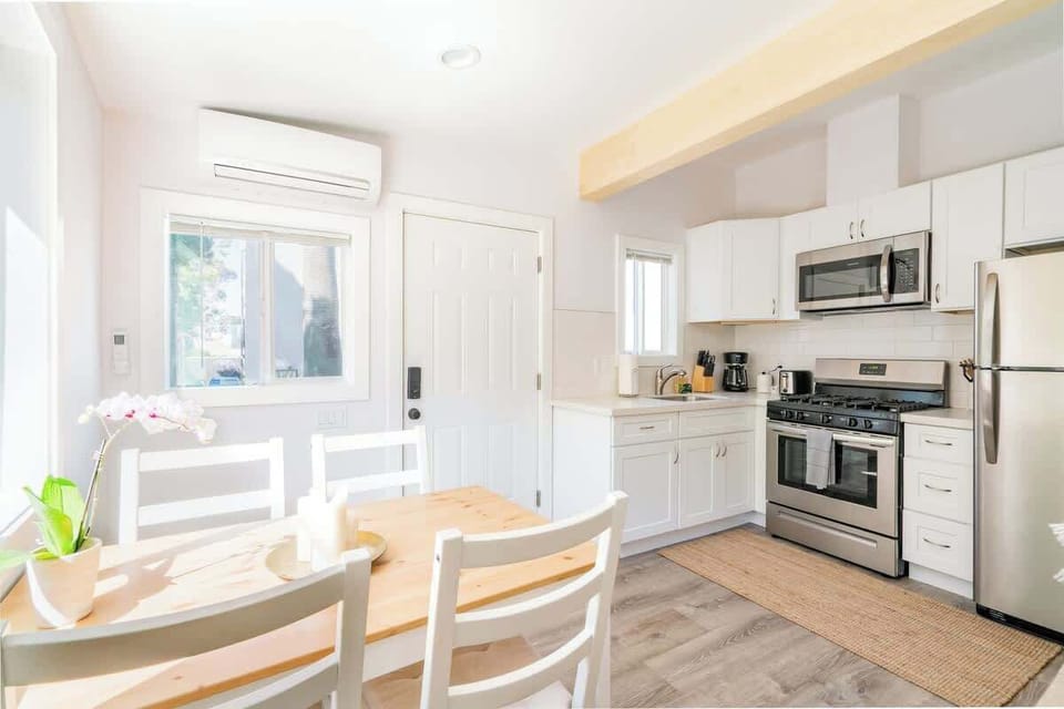 Cook, eat, wine and dine in the open kitchen and dining area 