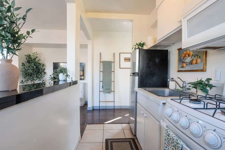 Gather around the breakfast bar in our modern kitchen, complete with all the essentials
