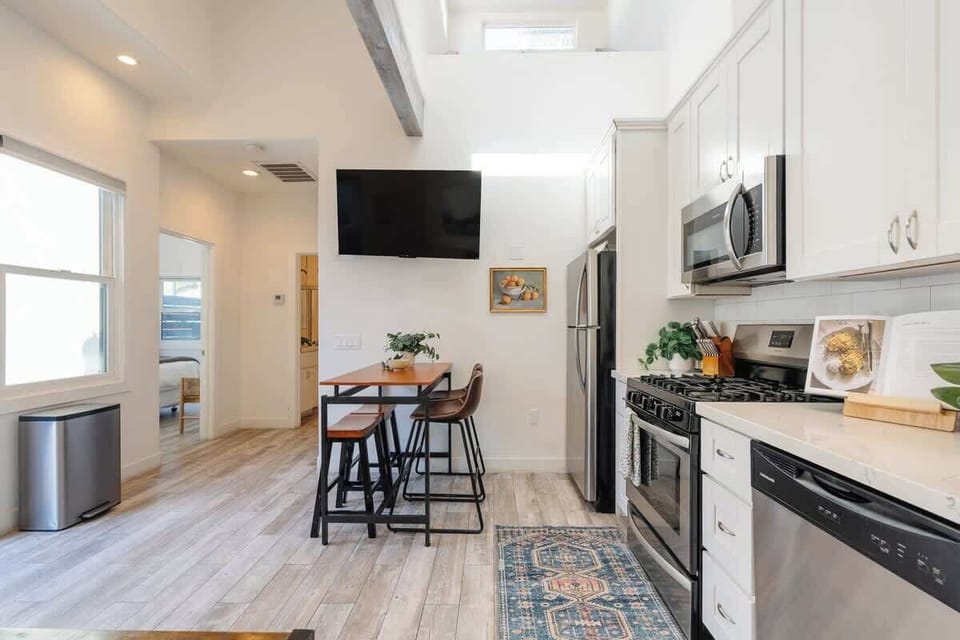 Experience seamless open-concept living from the sofa to the kitchen and dining area.