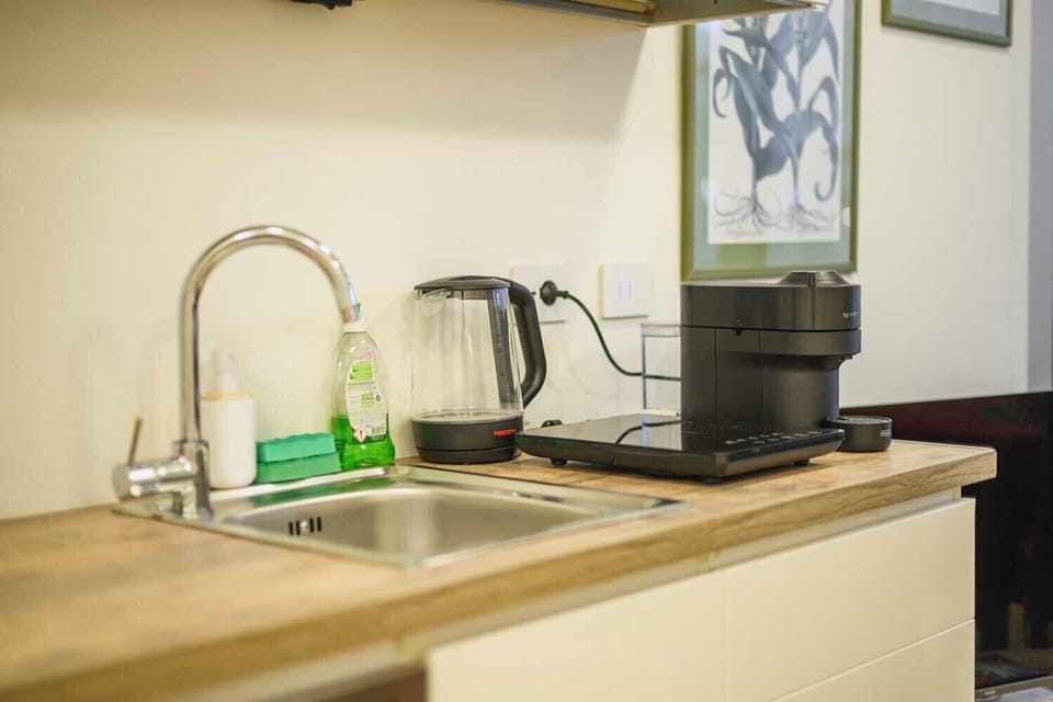 Espresso maker, coffee/tea maker, fridge, electric kettle