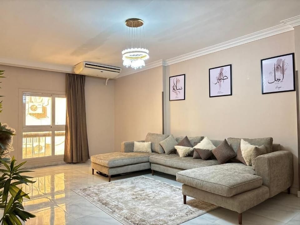 Deluxe Apartment, 3 Bedrooms | Living area | Flat-screen TV
