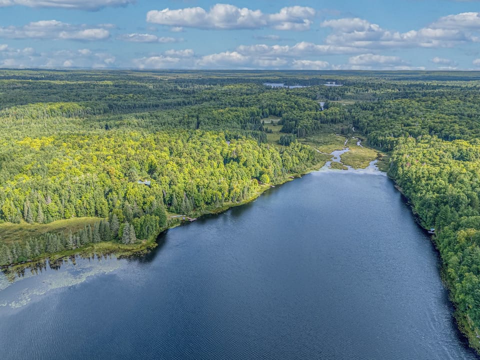 Panoramic aerial view of the crystal-clear lake – discover the pristine beauty of Little Martha Lake, perfect for fishing and quiet water sports.