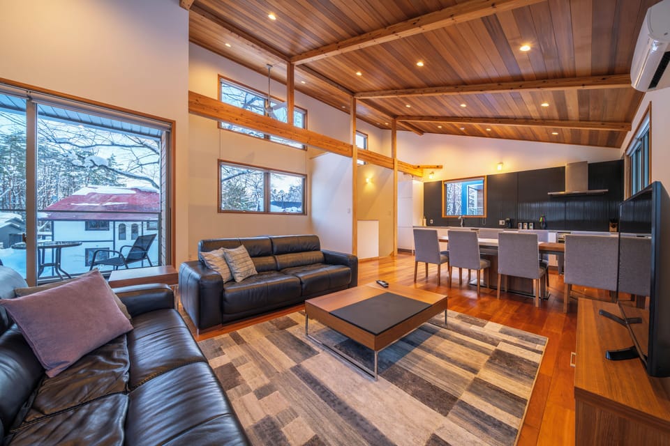 Luxury Chalet | Living area | 55-inch flat-screen TV with digital channels, TV, iPod dock