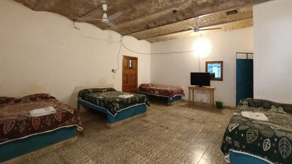 Standard Quadruple Room, Air conditioning | Laptop workspace