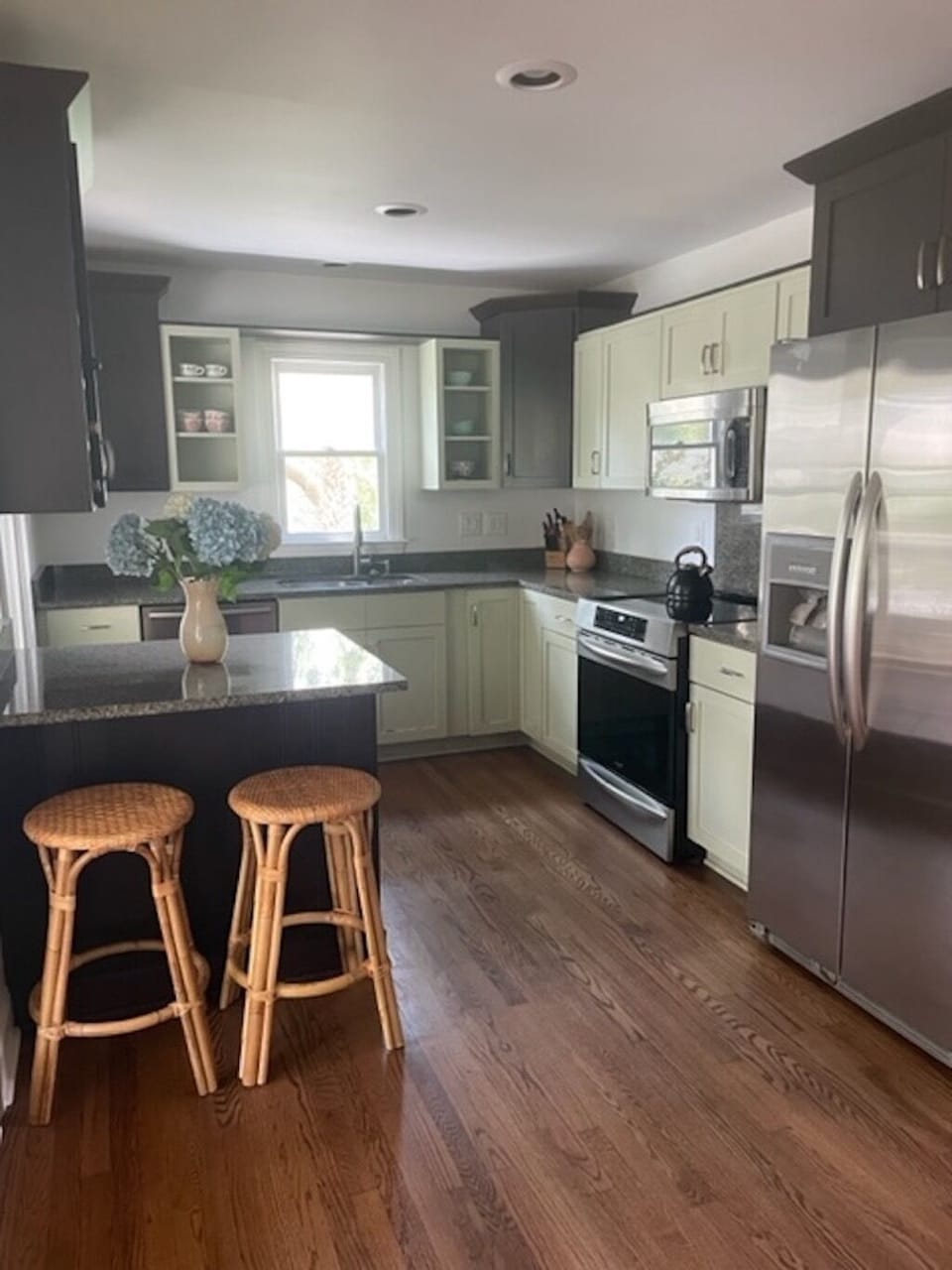 kitchen is fully stocked with cookware, dishware, etc