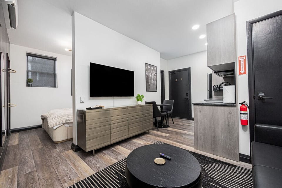 Living area with TV (including Netflix), Small Kitchen, and Table