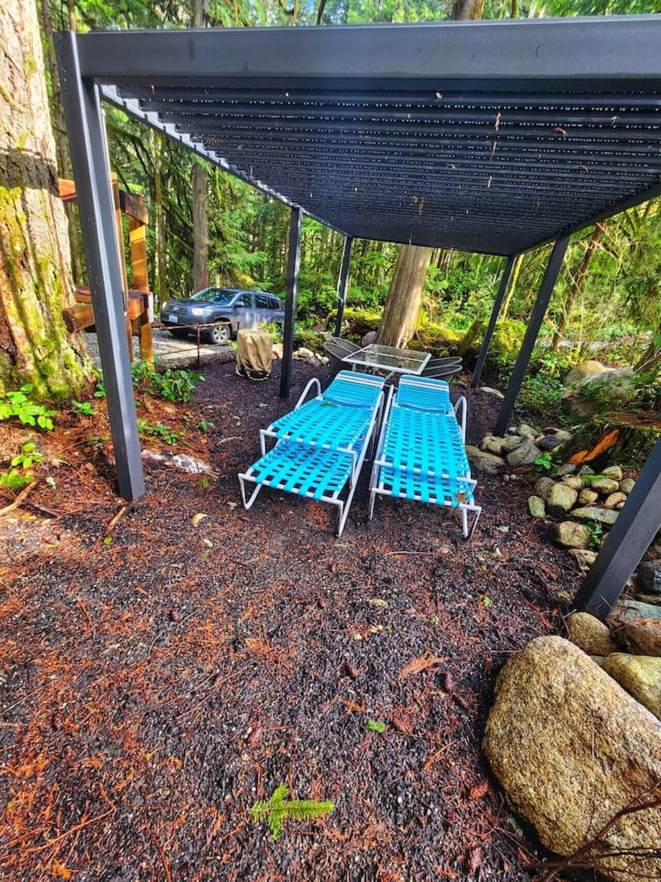 Plenty of seating around the pergola covered dining table and propane fire table.