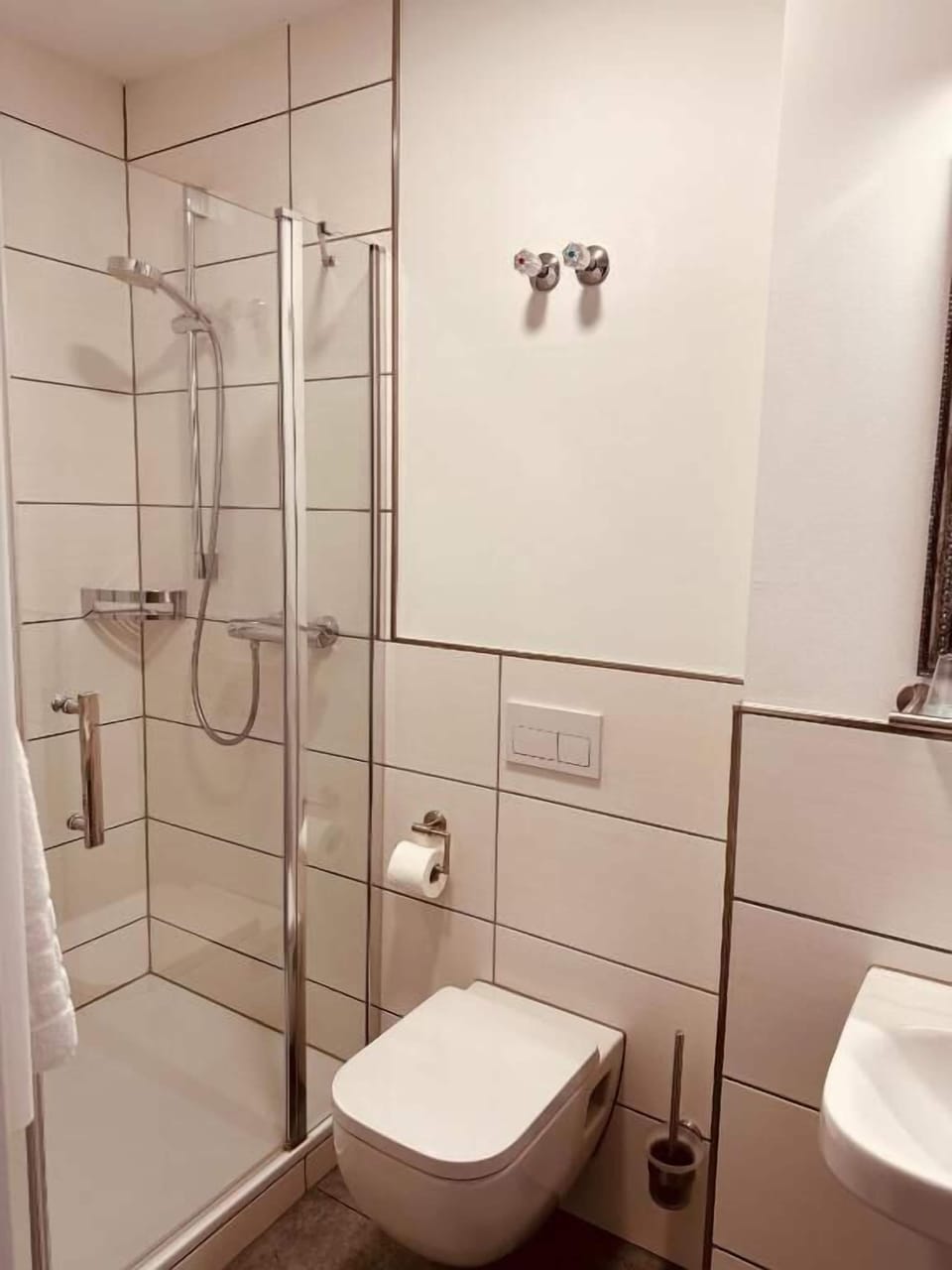 Shower, hair dryer, towels, toilet paper