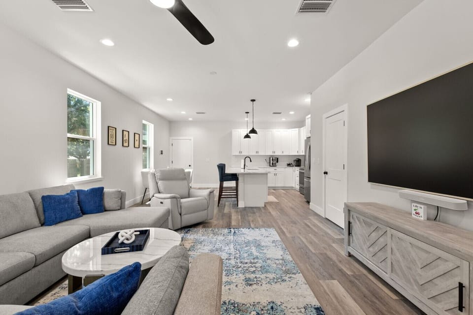Relax in the living room with comfy seating open to the kitchen area