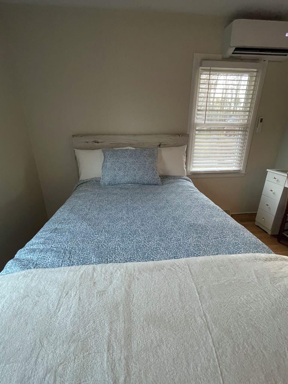 Comfortable queen bedroom with natural light near Downtown Brevard & Pisgah.