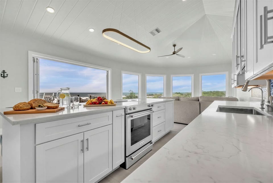 Designed for cooking and gathering, this chef’s kitchen offers expansive counters, premium finishes, and breathtaking views