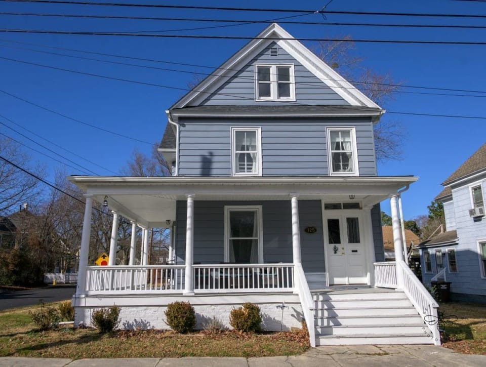 The front porch is great to enjoy the breeze, coffee, or a glass of wine
