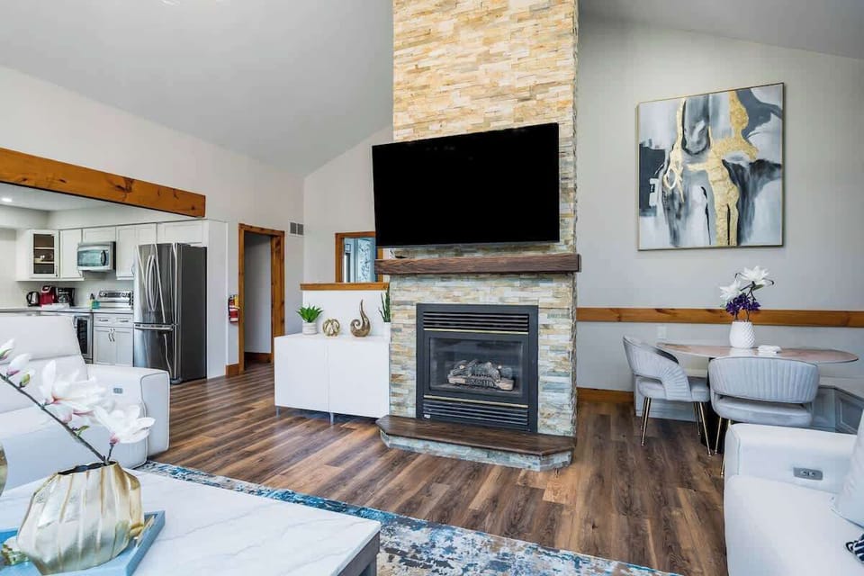 Gas fireplace and large TV to warm up in the winter
