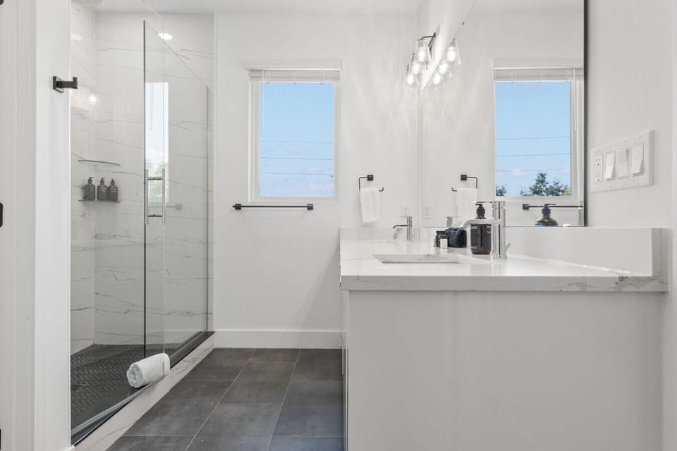 Guest bathroom with double vanity and shower