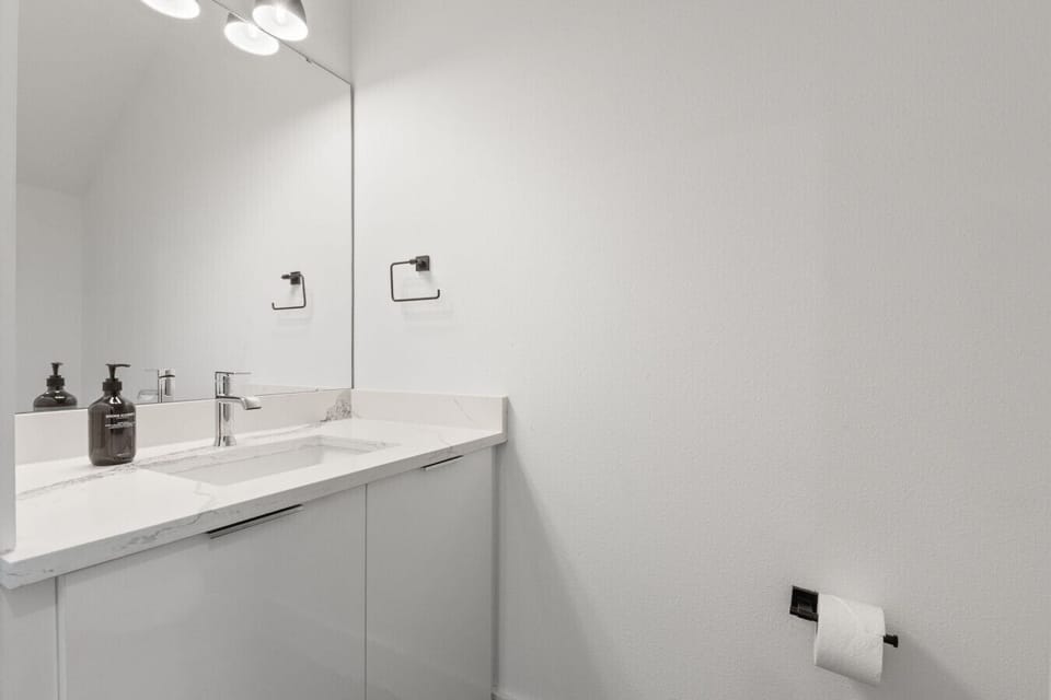 Half bath, located on the first floor right off the living area