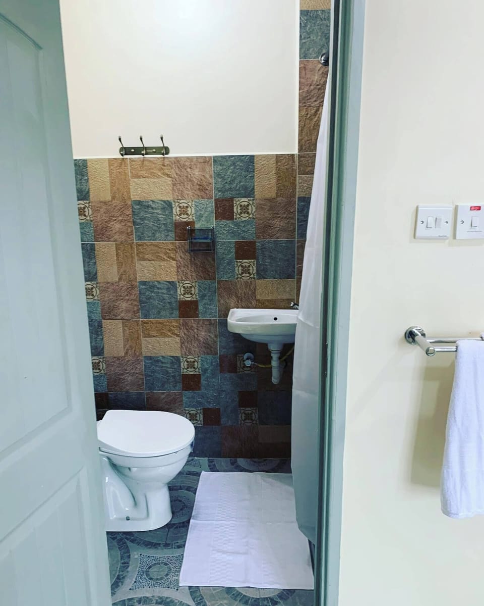 Shower, slippers, towels, soap