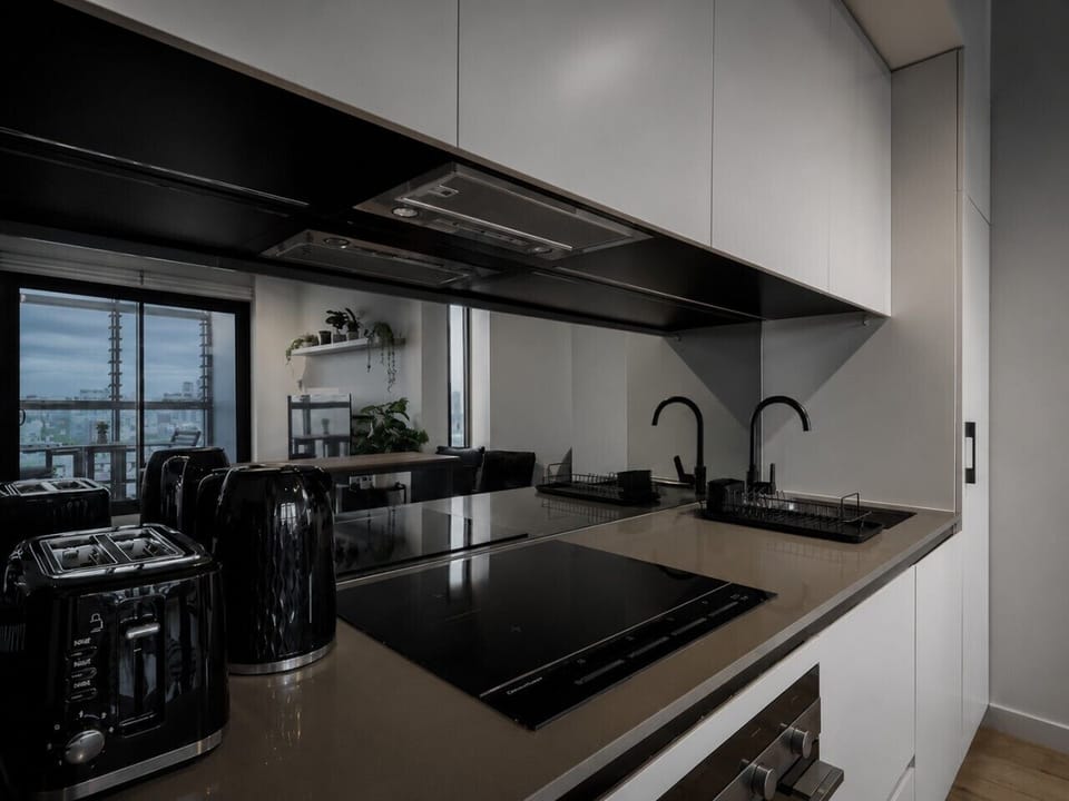 The kitchenette comes with an island bench and nook, and is fully equipped for a convenient stay.