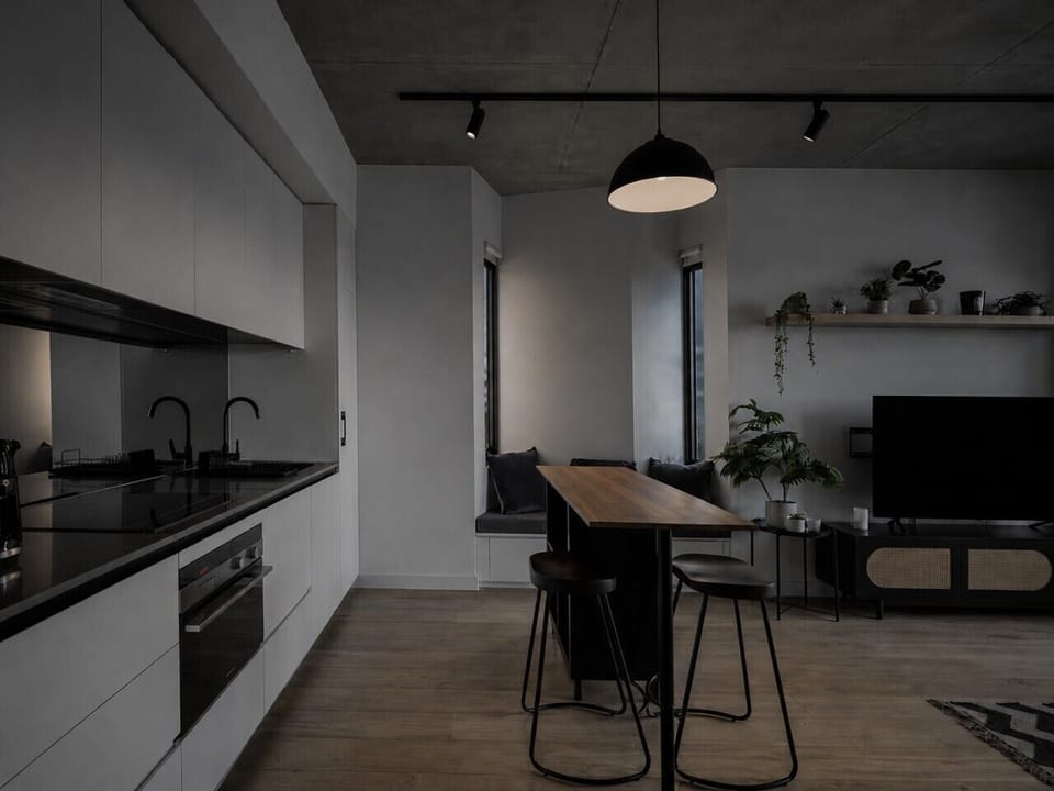The kitchenette comes with an island bench and nook, and is fully equipped for a convenient stay.