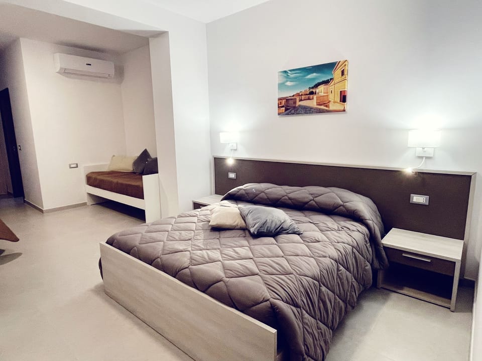 Family Quadruple Room | In-room safe, desk, laptop workspace, blackout drapes