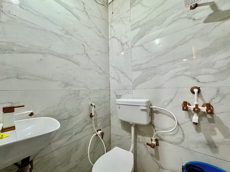 Shower, towels, soap, toilet paper