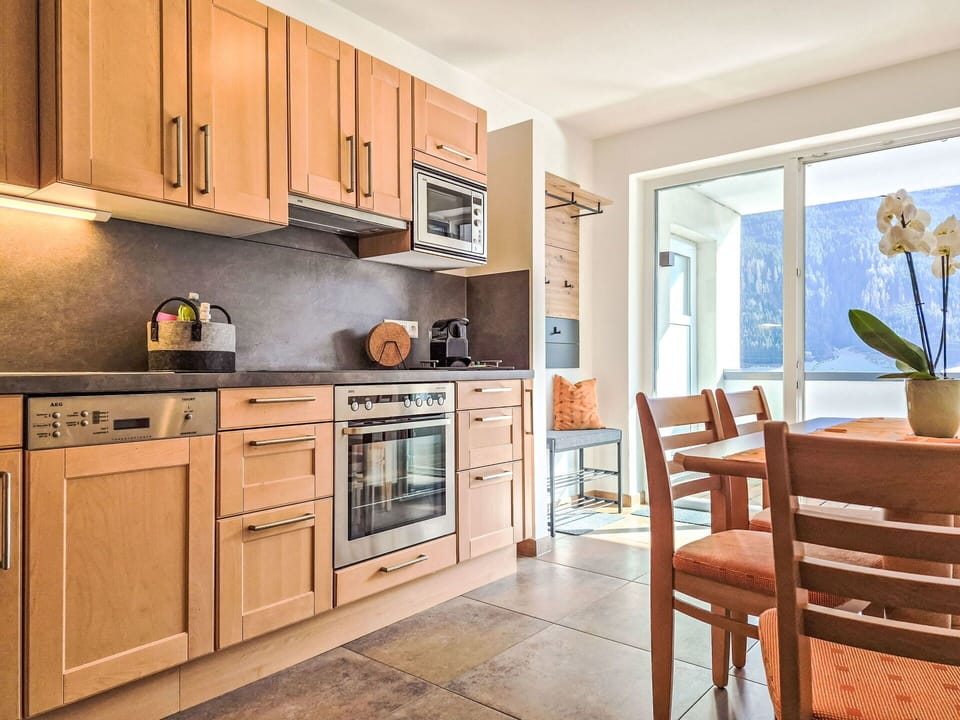 Furniture, Kitchen, Interior Design, Cabinetry, Kitchen Appliance, Countertop, Flooring, Major Appliance, Wood, Room